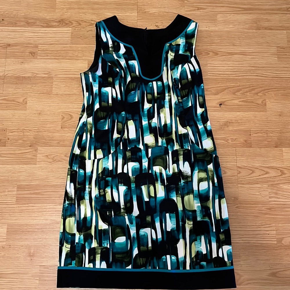Cute sleeveless work dress by AGB with a cute black and green print.